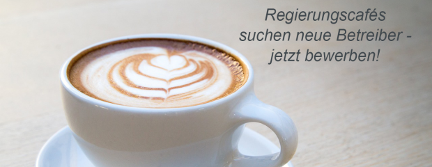 Das Foto zeigt eine Kaffeetasse und den Schriftzug Regierungscafés suchen neue Betreiber - jetzt bewerben!